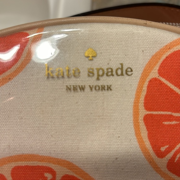 Kate Spade 11” clutch NWT. The only flaw is a small water mark under plastic. - Picture 12 of 16